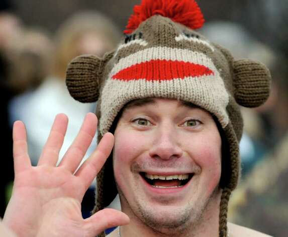 <b>Brian Beardsley</b> of Amsterdam wears a festive hat for his third swim at the <b>...</b> - 628x471