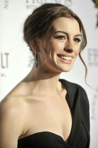 LOS ANGELES CA DECEMBER 10 Anne Hathaway poses for a picture at the 
