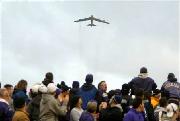 A B-52 bomber flies overhead before the start of the 2007 Apple Cup, the annual football game between
 the University of Washington and Washington State University. Photo: Mike Kane, Seattle
 Post-Intelligencer / SL