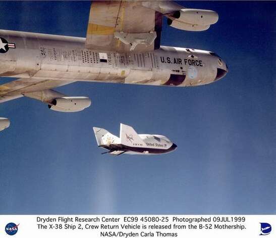 The X-38 research vehicle drops away from NASA's B-52 mothership
 immediately after being released from the B-52's wing pylon in July 1999. The X-38 was a series of five research prototypes for a new, reusable space station crew return vehicle. It has since been cancelled. Photo: NASA / SL