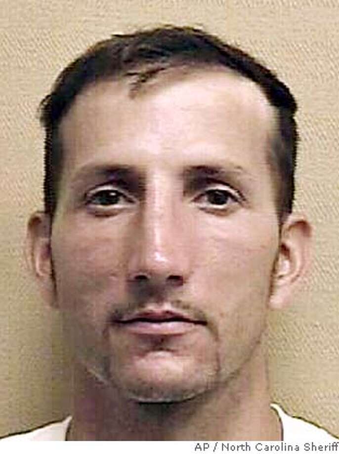 In a photo provided by the North Carolina Sheriff's Department Jeffrey Allen Manchester is shown. Manchester, who was four years into a 45-year robbery sentence allegedly sneaked out of the Brown Creek Correctional Institution on June 15 by clinging to the undercarriage of a truck was recaptured this week and accused of robbery after surviving for months by hiding out in a vacant electronics store and eating stolen baby food, police said. (AP Photo/North Carolina Sheriff) Photo: HO