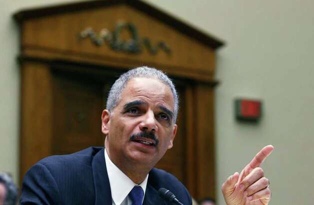 Attorney General Eric Holder testifies during a House Oversight and Government Reform Committee hearing on the Fast and Furious gun-tracking operation. Photo: Mark Wilson, Getty Images / 2012 Getty Images