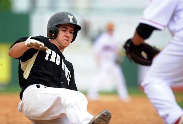 Trumbull's Ryan Fritz slides safely into third base during Saturday's FCIAC baseball championship game at the Ballpark at Harbor Yard in Bridgeport on May 26, 2012. Photo: Lindsay Niegelberg / Stamford Advocate