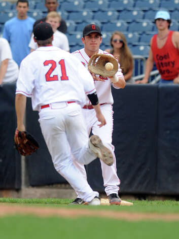Greenwich's Kyle Ballone makes a catch at first base during Saturday's FCIAC baseball championship game at the Ballpark at Harbor Yard in Bridgeport on May 26, 2012. Photo: Lindsay Niegelberg / Stamford Advocate