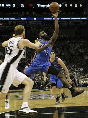 Oklahoma City Thunder's James Harden (13) drives against San Antonio Spurs' Matt Bonner (15) during the first half of game two of the NBA Western Conference Finals in San Antonio, Texas on Tuesday, May 29, 2012. Kin Man Hui/Express-News (Kin Man Hui / San Antonio Express-News) / SA