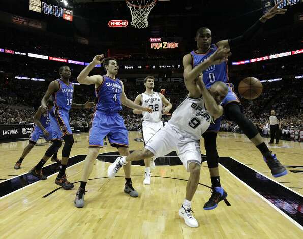 San Antonio Spurs' Tony Parker (9) is fouled by Oklahoma City Thunder's Russell Westbrook (0) during the first half of game two of the NBA Western Conference Finals in San Antonio, Texas on Tuesday, May 29, 2012. Kin Man Hui/Express-News (Kin Man Hui / San Antonio Express-News) / SA