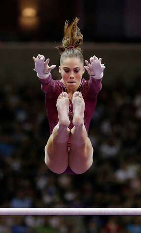 McKayla Maroney competes on the uneven bars during the final round of the women's Olympic gymnastics trials, Sunday, July 1, 2012, in San Jose, Calif. Maroney was named to the U.S. Olympic gymnastics team. (AP Photo/Gregory Bull) Photo: Gregory Bull, Associated Press / AP
