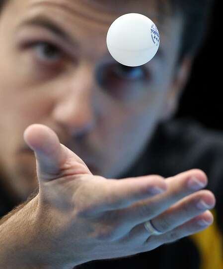 Timo Boll of Germany competes against Leung Chu Yan of Hong Kong in the men&#39;s team - 960x540