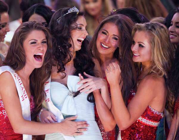 Miss World  runner-up winner Miss Wales Sophie Moulds, second left, is congratulated by other contestants. Photo: AP / SL