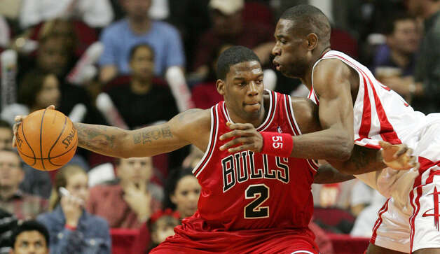 The Chicago Bulls' Eddy Curry (2) works for position against the Houston Rockets' Dikembe Mutombo (right) during the second quarter Wednesday, Feb. 9, 2005 in Houston. (David J. Phillip / Associated Press) Photo: DAVID J. PHILLIP, AP / AP