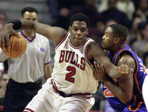 Chicago Bulls rookie Eddy Curry drives to the basket against the New York Knicks' Othella Harrington during the first quarter Saturday, Nov. 03, 2001, in Chicago. (Stephen J. Carrera / Associated Press) Photo: STEPHEN J. CARRERA, AP / AP