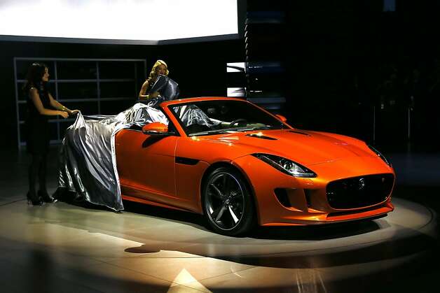 The all-new F-TYPE with special-order Firesand paintwork and equipped with optional 'Design' and both exterior and interior 'Black' packs, made its Auto Show debut at the LA Auto Show on November 28, 2012 in Los Angeles, California. Photo: Neilson Barnard, Getty Images For Jaguar Land Rov / SF
