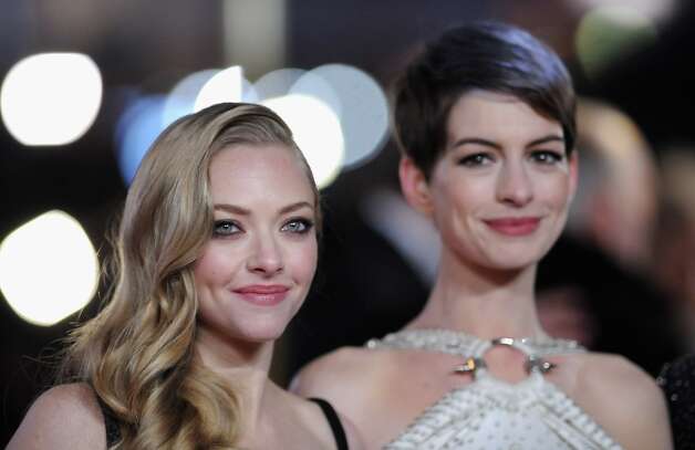 Actresses Amanda Seyfriend and Anne Hathaway attend the Les Miserables World Premiere at the Odeon Leicester Square on December 5, 2012 in London, England.  (Photo by Stuart Wilson/Getty Images) Photo: Stuart Wilson, Getty Images / 2012 Getty Images