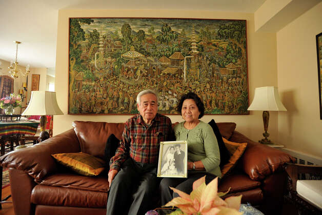 Benny Widyono and his wife, Francisca, display a photograph of themselves on their wedding day, 50 years ago, at their home in Stamford on Monday, Feb. 4, 2013. Photo: Jason Rearick / The News-Times