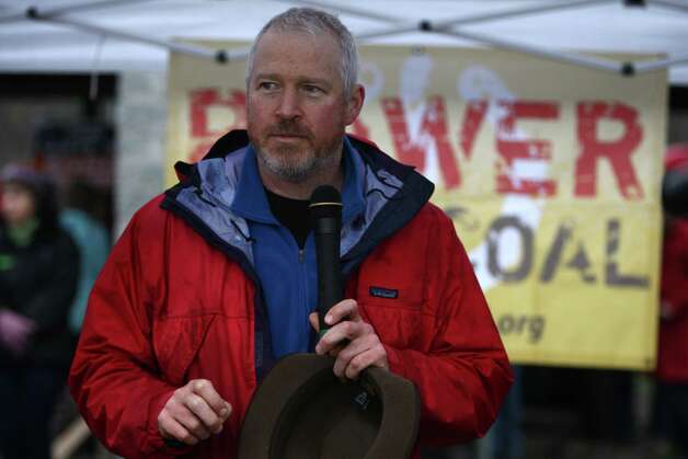 Seattle Mayor Mike McGinn speaks during a protest against proposed coal trains that would pass through Seattle on Sunday, February 17, 2013 at Seattle's Golden Gardens Park.