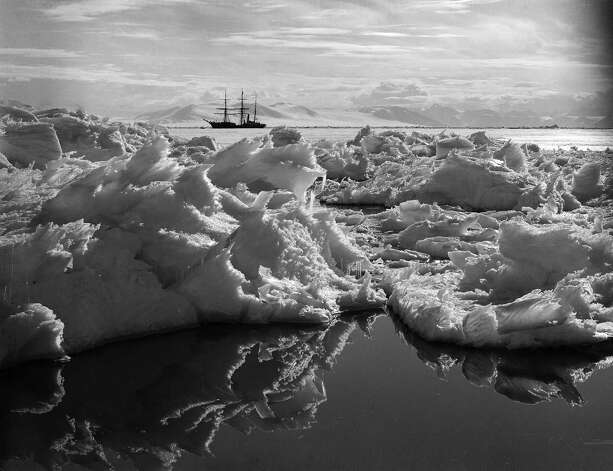 Beautiful ice reflections in the water with the Terra Nova ship in the background. Photo: Popperfoto, H.G. Pointing/Terra Nova / Popperfoto