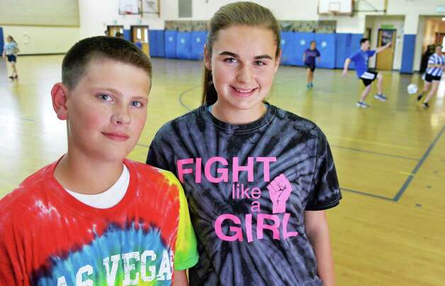 Cohoes Middle School students Danny Buchanan,12, left, and Bryanna Pelkey, 13, at the indoor soccer tournament they organized to raise awareness and donations for the Autism Society at their school in Cohoes, NY, Wednesday June 5, 2013.    (John Carl D'Annibale / Times Union) Photo: John Carl D'Annibale / 00022696A