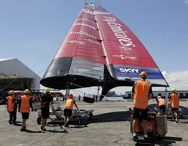 The shore crew for Emirates Team New Zealand prepares one of the huge wing sails for installation onto the AC72 boat in San Francisco. Photo: Paul Chinn, The Chronicle
