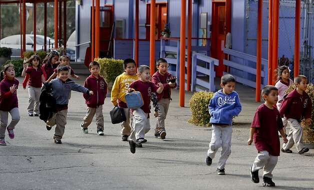 Students break for recess at Lazear Charter Academy in Oakland. Lazear, a public school that was closed by the school board last year, reopened as a charter campus after an appeal to the Alameda County Board of Education. Photo: Michael Macor, The Chronicle