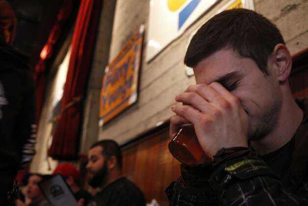 Brandon Frankel takes a big whiff of the ale as he tastes it for the first time. Frankel drove from Los Angeles for the event. Photo: Lacy Atkins, The Chronicle