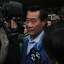 State Sen. Leland Yee makes his way through a large flock of media members to a car after being released on a $500,000 bond March 26, 2014 outside of the Federal Courthouse in San Francisco, Calif. State Sen. Leland Yee was arrested on public corruption charges early Wednesday morning.