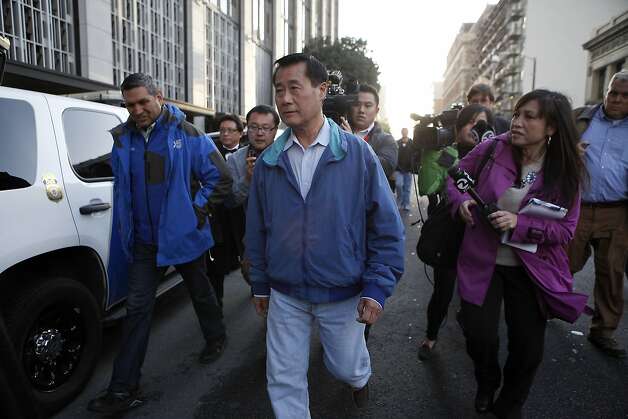 Senator Leland Yee is chased by reporters as he leaves the federal building in San Francisco, CA, Wednesday Mar. 26, 2014.  The FBI raided State Sen. Leland Yee's office in Sacramento and other locations were searched by the FBI in San Francisco. He was reportedly arrested on public corruption charges Wednesday morning amid raids of his office in Sacramento and searches by the FBI in San Francisco. Photo: Michael Short, The Chronicle