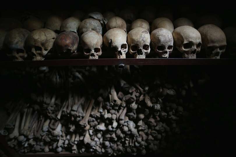 NYAMATA, RWANDA - APRIL 04:  Metal racks hold the bones of thousands of  genocide victims inside one