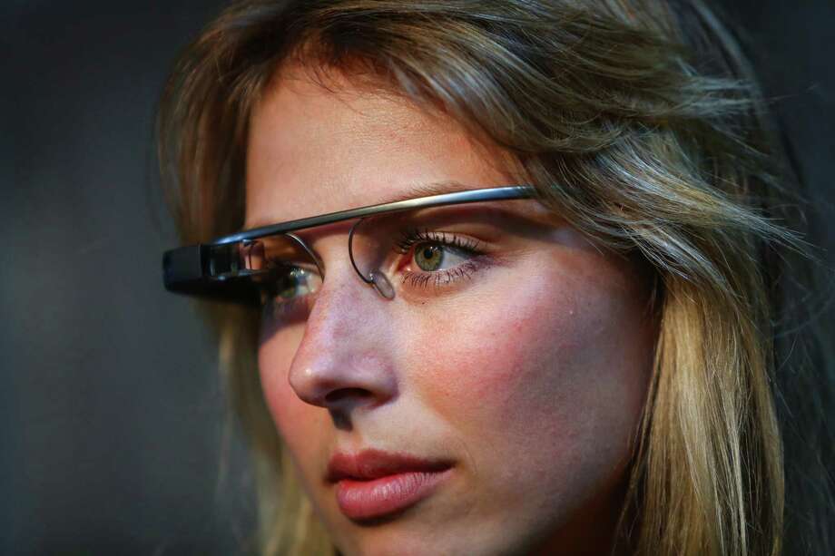Glass guide Elena De Sosa wears Google Glass during a public preview of the device on - 920x920