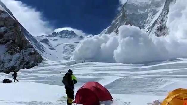 The avalanche that killed at least thirteen sherpas is pictured as it barrels down a mountain in the Mount Everest Region on April 18, 2014. Rescuers on Mount Everest April 19 found the body of a 13th Nepalese guide buried under snow as authorities ruled out hope of finding any more survivors from the deadliest accident ever on the world's highest peak. AFP PHOTO/Buddhabir RAIBuddhabir RAI/AFP/Getty Images Photo: Buddhabir Rai, AFP/Getty Images