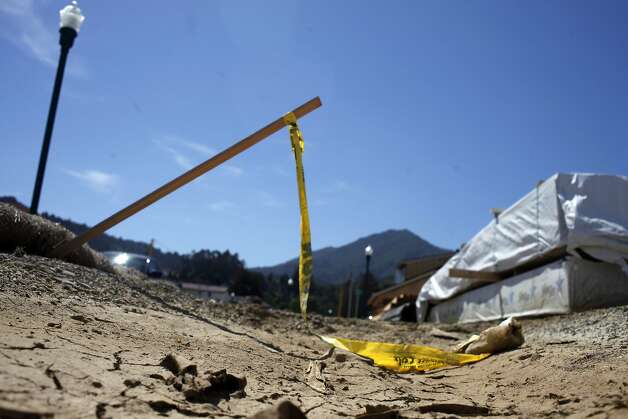 Caution tape and building supplies for the Rose Lane Development sit on the site, Wednesday April 16, 2014, in Larkspur, Calif. The development is being built on top of a large Native American burial ground and village site containing tools, harpoon tips, musical instruments, weapons, the bones of grizzly bears and a rare ceremonial California condor burial. Photo: Lacy Atkins, SFC