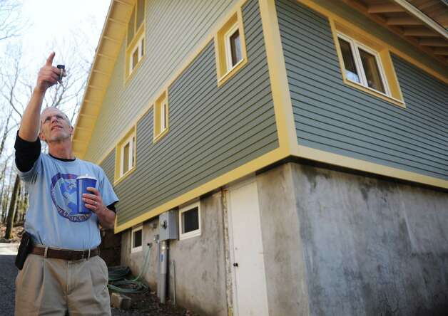 Local builder and home owner Mike Troelle shows off his energy-efficient home near Waubeeka Lake in Danbury, Conn. Thursday, May 1, 2014. Troelle is one of the winners of Connecticut's Zero Energy Challenge for modifications he made to his home during a major renovation project. Photo: Tyler Sizemore / The News-Times
