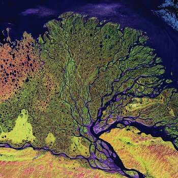 Lena River Delta, Russia – The delta is frozen tundra for about seven months of the year, and spring transforms the region into a lush wetland. Photo: Boyd, John, Source: "Earth As Art," Published By NASA