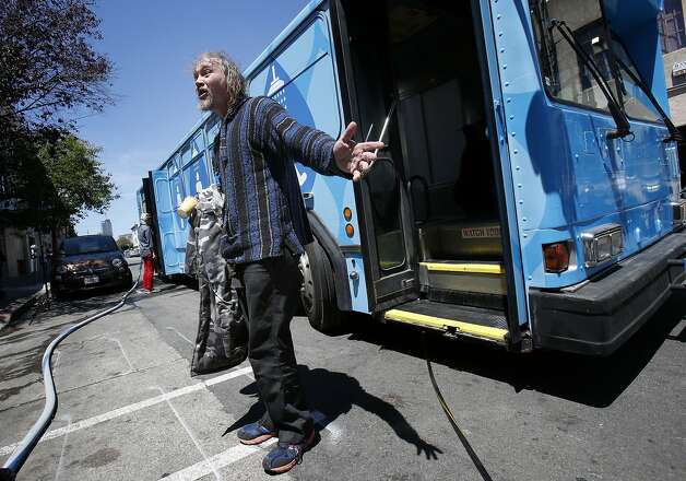 Silas Borden, who is homeless, emerges with a smile after a shower in the Lava Mae bus in the Mission District. Photo: Brant Ward, San Francisco Chronicle