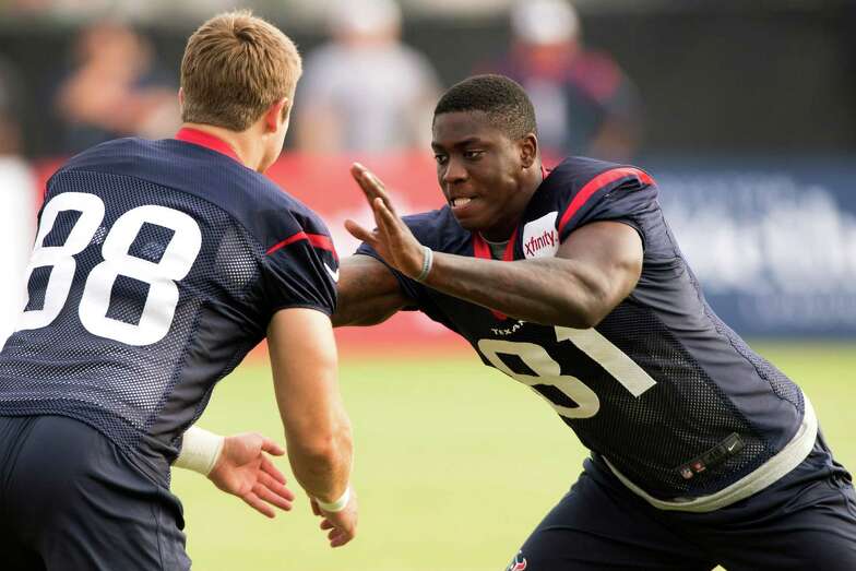 Hoping to make the Texans cut, Anthony Denham, right, already knows what it's like to be a survivor.