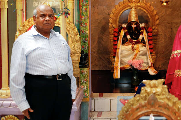 Mattur Balakrishna, (cq) stands beside the statue of Lord Krishna inside the Albany Hindu Temple, on August 13, 2014 in Loudonville, N.Y.  (Tom Brenner/ Special to the Times Union) Photo: Tom Brenner / Â©Tom Brenner/ Albany Times Union