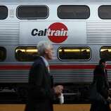 Commuters board trains at the Caltrain station in San Francisco. Record ridership growth has Caltrain officials looking for new ideas to accommodate more passengers in coming years.