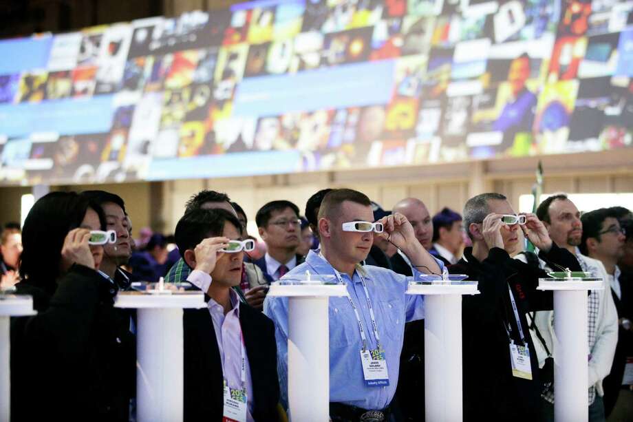 People try out the Sony Smart Eyeglass prototypes at last year’s International Consumer Electronics Show. Photo: Jae C. Hong / Associated Press / AP