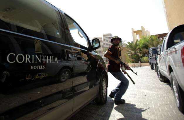 Gunmen storm Libyan hotel; 4 foreigners, 5 guards dead - Times Union