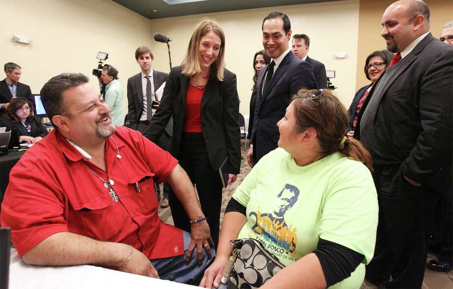 U.S. Secretary of Health and Human Services Sylvia Burwell, center, and U.S. Secretary of Housing and Urban Development Julian Castro, standing right of Burwell, visited with Robert and Linda Contreras in San Antonio earlier this year as the couple enrolled in health insurance at CentroMed. Mid-priced silver plans proved more popular among consumers going through federal and state exchanges to buy health insurance, a Commonwealth Fund report found. Shoppers who bypassed the exchanges and paid full price for their health insurance were more open to buying pricier gold and platinum plans than consumers shopping in the federal and state venues, the report said. Photo: San Antonio Express-News /File Photo / ©2015 San Antonio Express-News