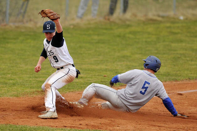 Staples third baseman Zach Azadian forces out Newtown's Jack Procaccini at third base during their baseball game at Staples High School in Westport, Conn., on Wednesday, April 8, 2015. Staples won, 5-4. Photo: Jason Rearick / Stamford Advocate