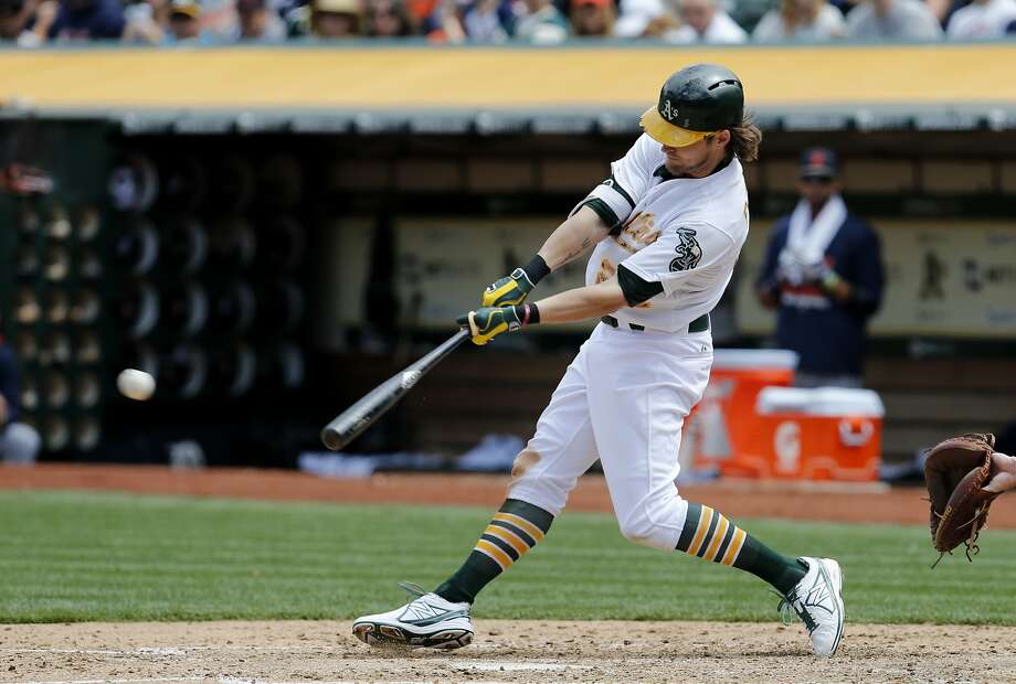 Josh Reddick (22) singled in the sixth inning with a runner on.  The Oakland A's battle the Detroit Tigers on Memorial Day at O.co Coliseum. It also marked the return of former Oakland A's slugger Yoenis Cespedes. Photo: Brant Ward, The Chronicle