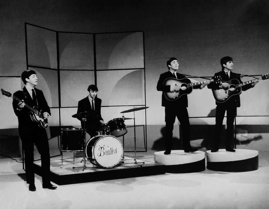 The Beatles early in their career, shortly after Ringo Starr joined the group. Note the short-lived "bug" band logo on Starr's drums. Photo: Keystone-France/Gamma Keystone