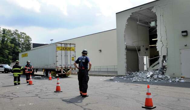 Danbury Firefighters respond to a wall collapse behind DSW Design Shoe ...