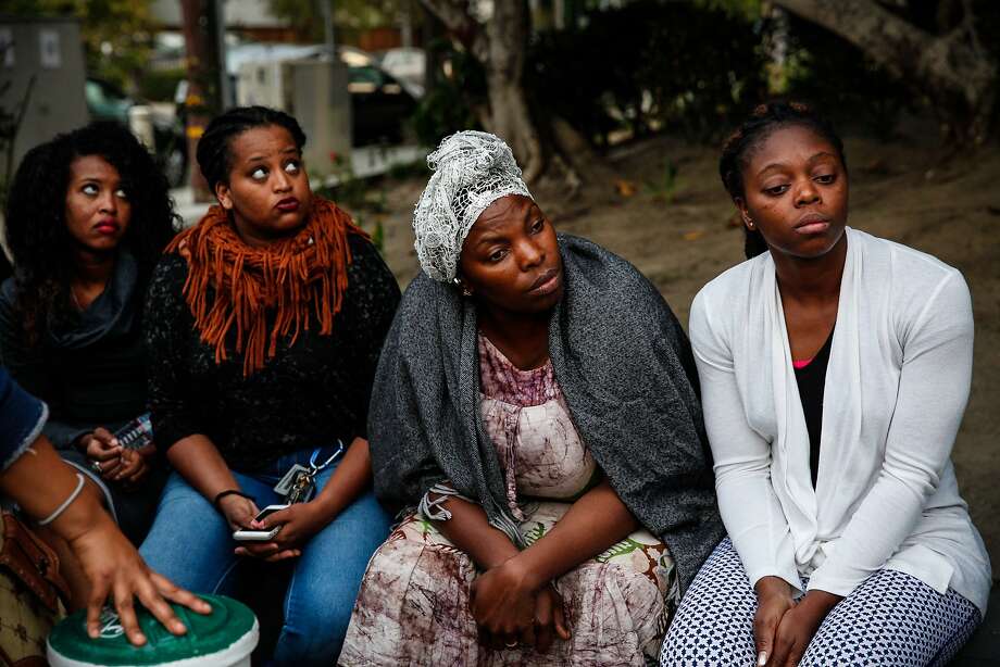 From right, Annick Seri, Nadege Nadege, Meheret Anulo, and Pineal Anulo listen at a candlelight vigil for Yonas Alehegne, an Ethiopian immigrant who was shot and killed by an Oakland police officer in August, in Oakland, Calif., on Sunday, September 13, 2015. Photo: Sarah Rice, Special To The Chronicle