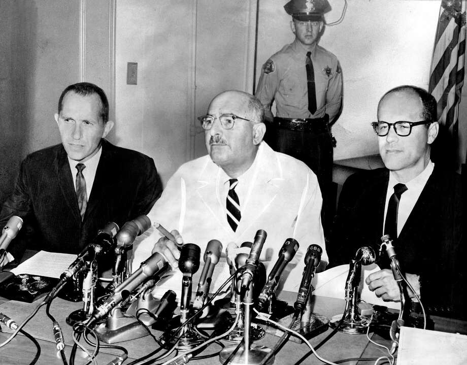 Norman Farberow, left, L.A. County Coroner Theodore J. Curphey and Dr. Robert Litman at the 1962 news conference announcing that Marilyn Monroe's death was a probable suicide. Farberow, who co-founded the country's first suicide prevention center, has died at age 97. (Los Angeles Times/TNS) Photo: Los Angeles Times, MBR / McClatchy-Tribune News Service / Los Angeles Times