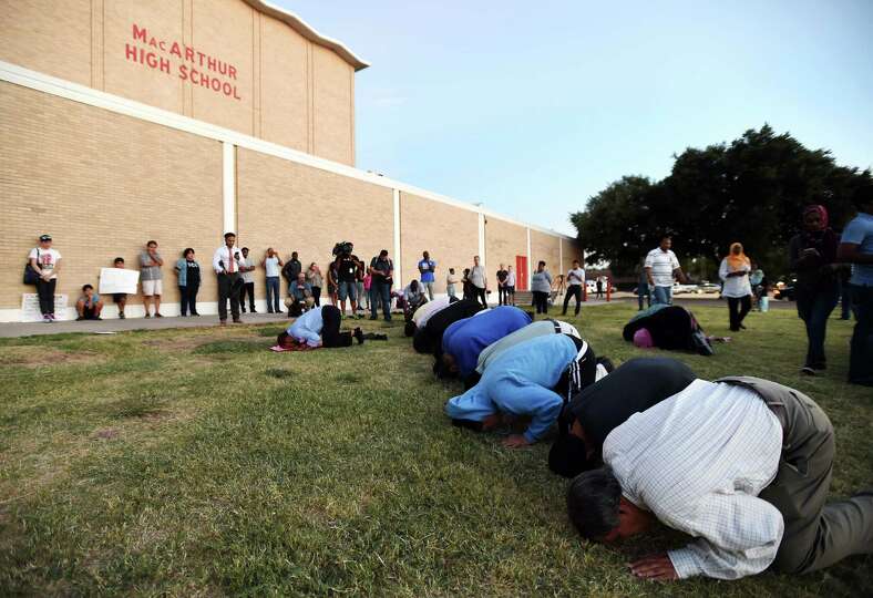 <b>Muslims</b> <b>pray</b> in front of MacArthur High <b>School</b> at a <b>prayer</b> vigil in ...