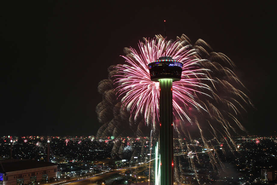Fireworks explode over Hemisfair Park and the Tower of the Americas at the start of Celebrate San Antonio fireworks display, Jan. 1, 2015. Making resolutions is easy during the New Years celebration, but work is required to keep them. Photo: JERRY LARA /San Antonio Express-News /  2014 San Antonio Express-News
