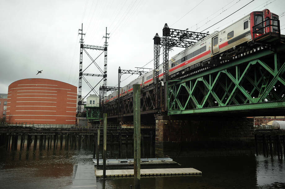 A Metro-North train heads east across the Walk Bridge over the Norwalk River in Norwalk last month. Photo: Brian A. Pounds / Hearst Connecticut Media / Connecticut Post