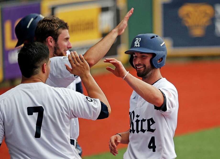 Rice's Hunter Kopycinski (4) is greeted at the dugout after he scored on a fielding error by Southeastern Louisiana in the fifth inning of an NCAA college regional baseball game in Baton Rouge, La., Saturday, June 4, 2016. (AP Photo/Gerald Herbert) Photo: Gerald Herbert, Associated Press / Copyright 2016 The Associated Press. All rights reserved. This material may not be published, broadcast, rewritten or redistribu