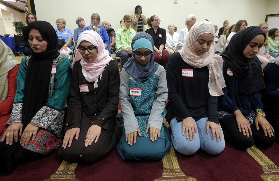 Non-Muslim members of the community watch a special prayer at the American Muslim Community Center in Longwood, Fla., after the mass-shooting at the Pulse Orlando nightclub. Photo: Phelan M. Ebenhack / Phelan M. Ebenhack / Associated Press / FR121174 AP
